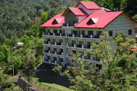 The majestic exterior of AHR The Dagshai Manor nestled amidst the verdant hills of Kasauli.
